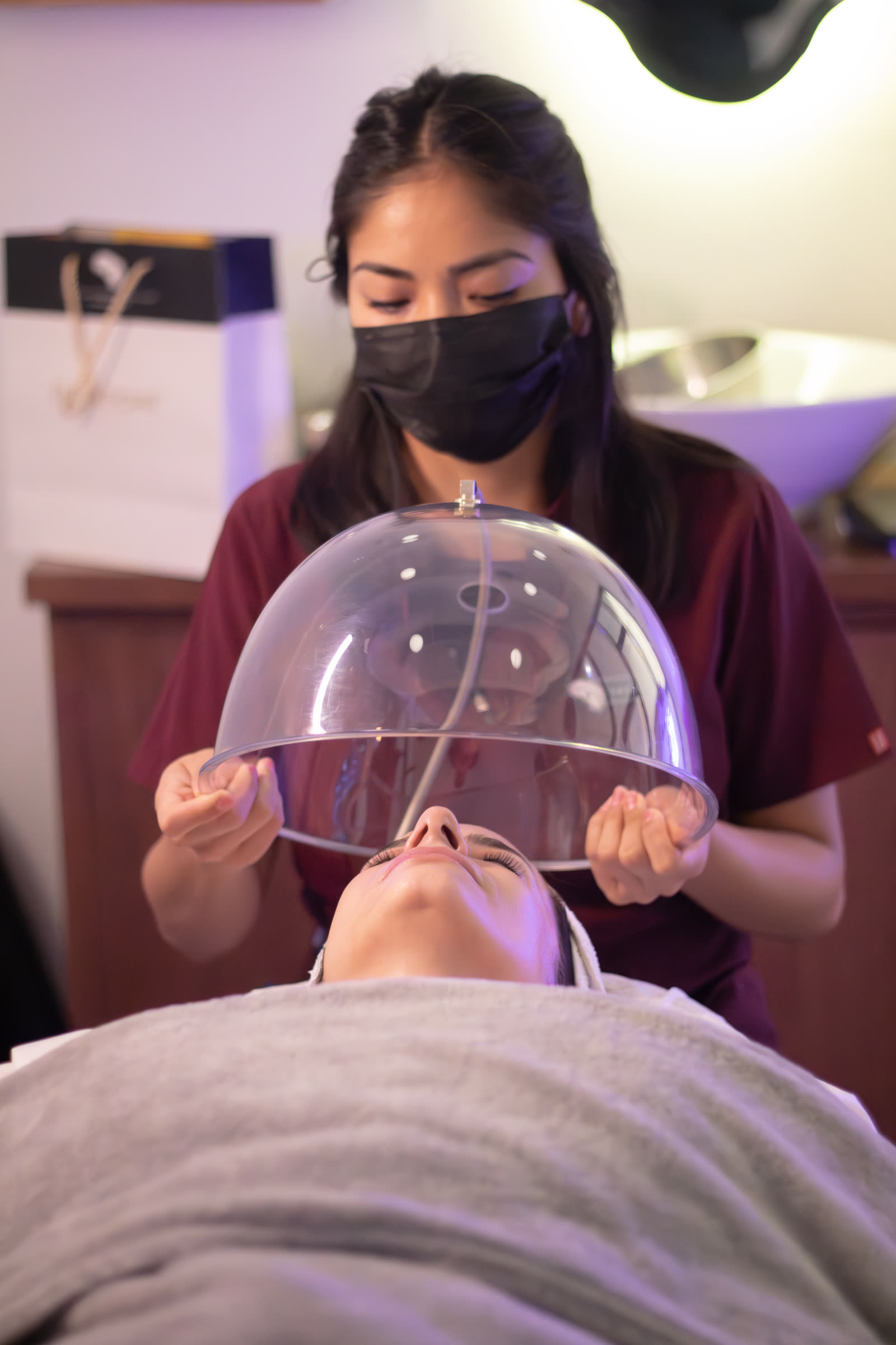 Specialist performing a collagen facial treatment