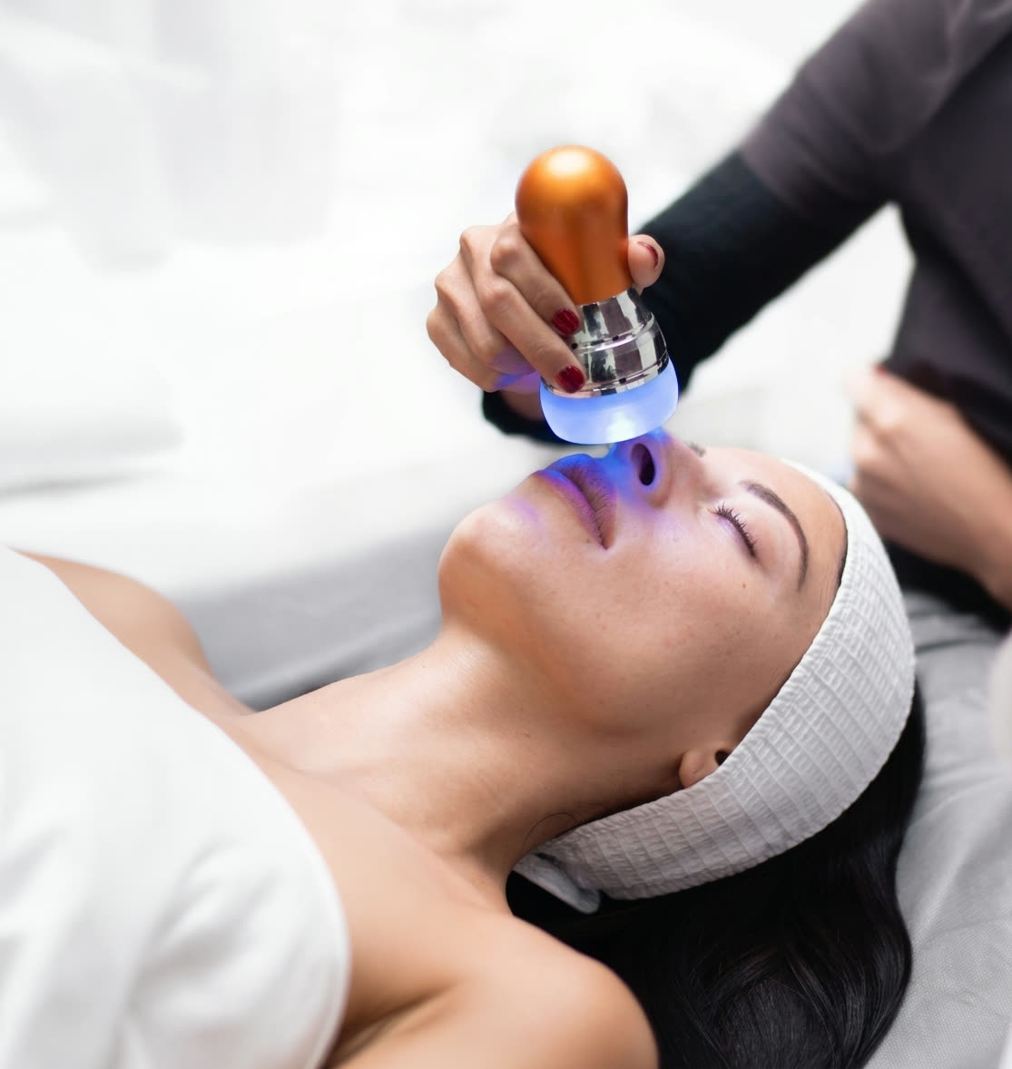Collagen facial device gliding across the skin
